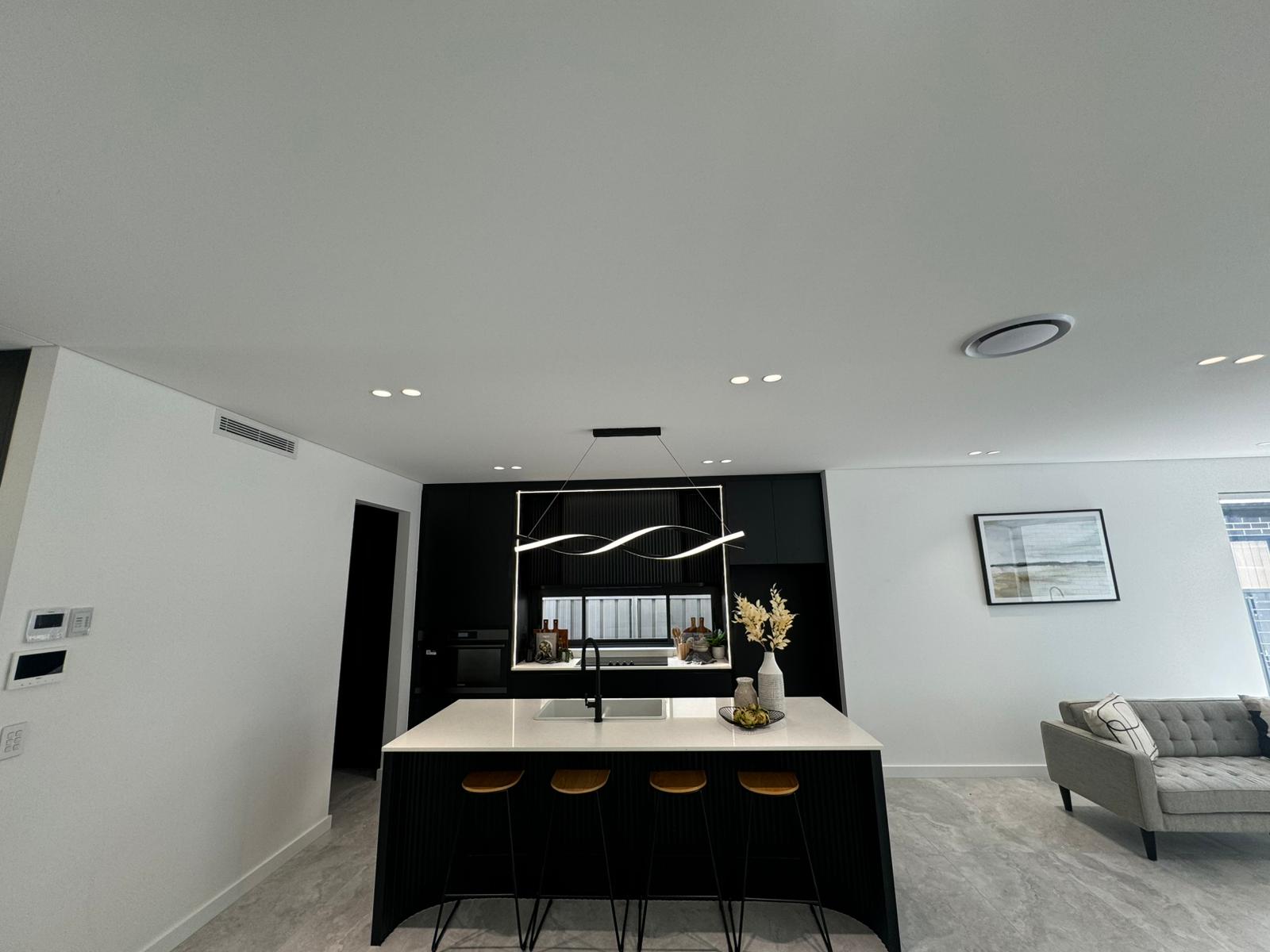 Finished kitchen with modern pendant lighting